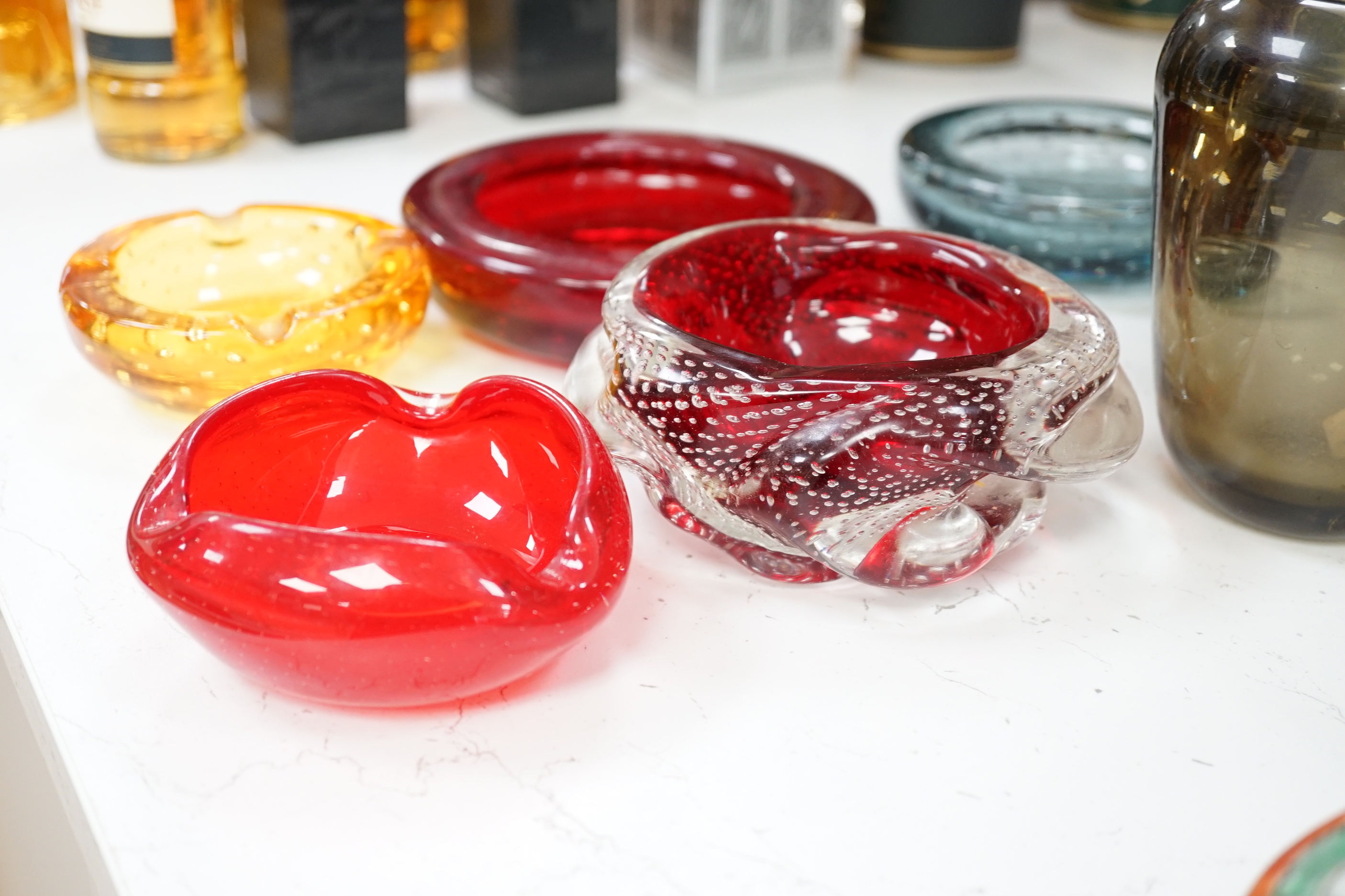 A group of thirteen pieces of mostly coloured art glass, tallest piece 31cm